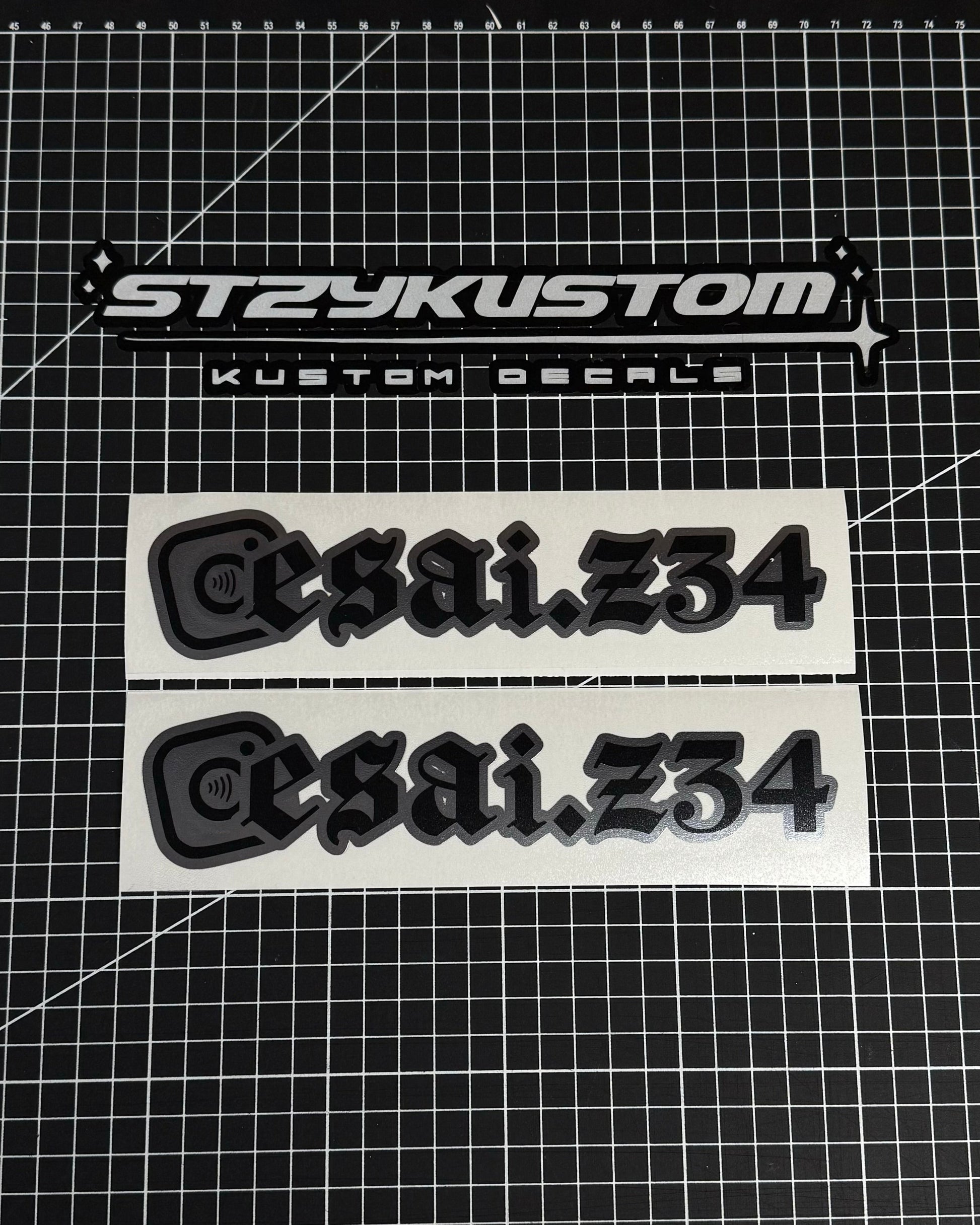 Two 'esai.234' decals on a grid background with 'STZYKUSTOM' branding.